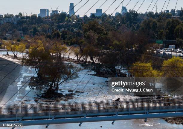 Bicyclist crosses the North Atwater Bridge in Atwater Village on Tuesday, Jan. 17, 2023. The LA River water level was dropping as the Southland faces...