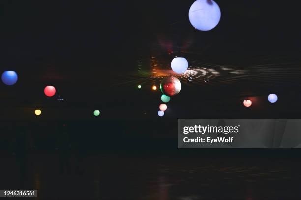 disco ball and colored lanterns hanging on ceiling in a music venue - wolf wallpaper imagens e fotografias de stock