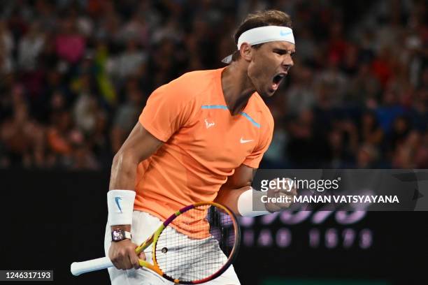 Spain's Rafael Nadal reacts as he plays against USA's Mackenzie McDonald during their men's singles match on day three of the Australian Open tennis...