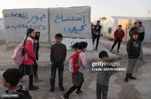 Displaced Iraqis from the Yazidi community are pictured at a camp for internally displaced persons in the Sharya area, some 15 kms from the northern...