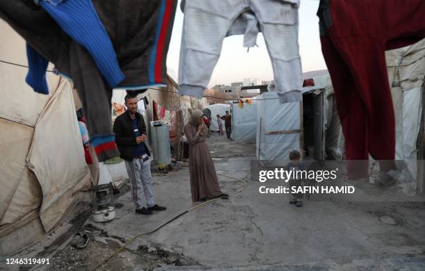 Displaced Iraqis from the Yazidi community are pictured at a camp for internally displaced persons in the Sharya area, some 15 kms from the northern...