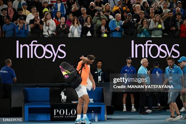 Spain's Rafael Nadal leaves after defeat against Mackenzie McDonald of the US in the men's singles on day three of the Australian Open tennis...