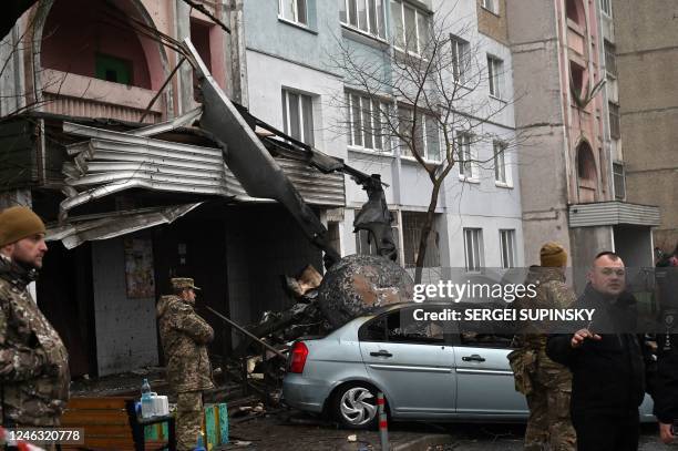 Military stand at the site where a helicopter crashed near a kindergarten in Brovary, outside the capital Kyiv, killing Sixteen people, including two...