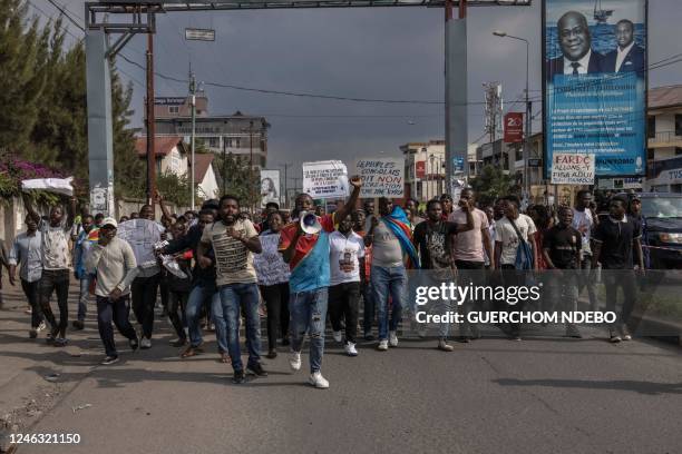 Demonstrators march during a demonstration against the East African Community Regional Force in Goma, eastern Democratic Republic of Congo, on...