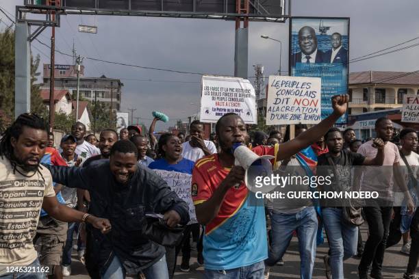 Demonstrators march during a demonstration against the East African Community Regional Force in Goma, eastern Democratic Republic of Congo, on...