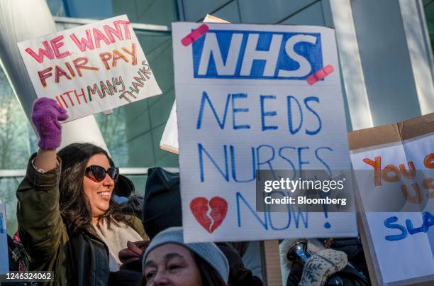Nurses hold placards and chant on a picket line during strike action by the Royal College of Nursing outside University College London hospital in...