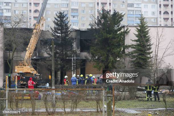 Personnel conduct search and rescue work after a helicopter crashed in the Brovary city near Kyiv, Ukraine on January 18, 2023. At least 17 people...