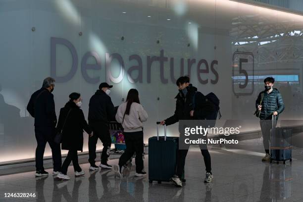 Passengers with luggages walk in Incheon International Airport on January 18 South Korea. According to Incheon International Airport Corporation, the...