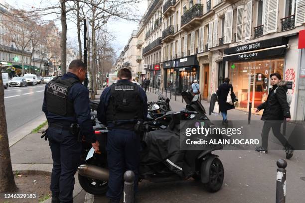 Police prepare the removal of vehicles located on the route of a demonstration, on the eve of nationwide strikes and protests against a pension...