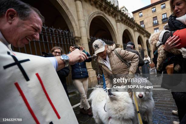 Pets are blessed by the parish priest Cesar Magaña outside the Church of San Nicolás in Pamplona to celebrate the day of San Antón Abad, the patron...