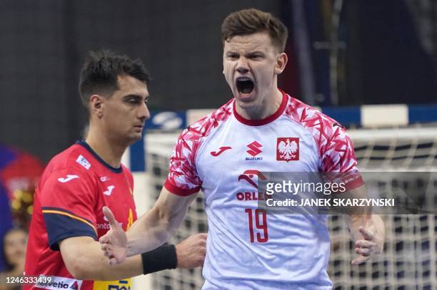 Poland's wing Jan Czuwara celebrates scoring during the Men's IHF World Handball Championship Group I match between Spain and Poland, in Krakow,...