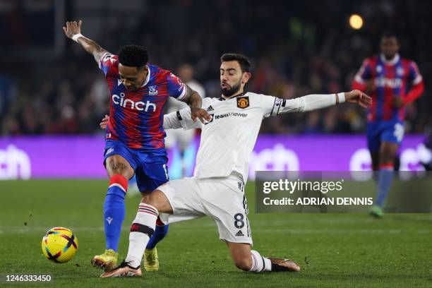 Crystal Palace's English defender Nathaniel Clyne fights for the ball with Manchester United's Portuguese midfielder Bruno Fernandes during the...