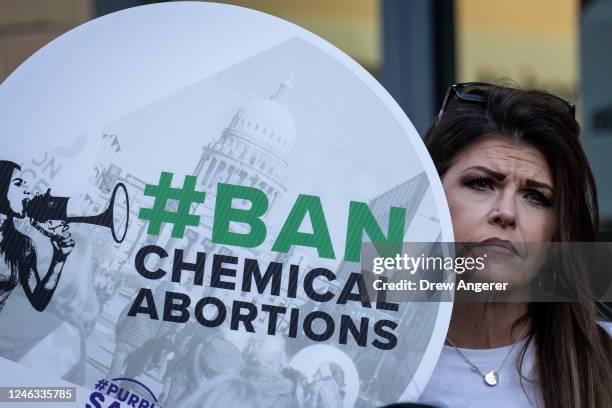 Anti-abortion activists protest against the availability of abortion pills at neighborhood pharmacies outside of a CVS Pharmacy on January 18, 2023...