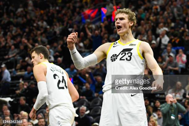 Lauri Markkanen of the Utah Jazz celebrates a dunk over Ivica Zubac of the LA Clippers during the second half of a game at Vivint Arena on January...