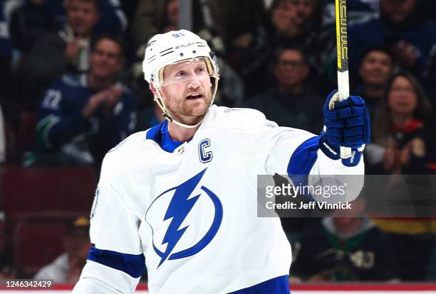 Steven Stamkos of the Tampa Bay Lightning raises his stick after his goal during the first period of their NHL game against the Vancouver Canucks at...
