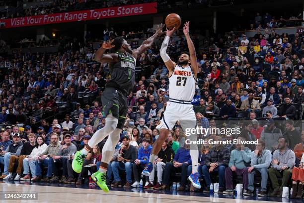 Jamal Murray of the Denver Nuggets shoots a three point basket during the game against the Minnesota Timberwolves on January 18, 2023 at the Ball...