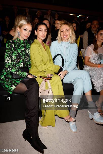 Leonie Hanne, Anna Nooshin and Viky Rader attend the Marc Cain Fashion Show Fall/Winter 2023 at Tempelhof Airport on January 18, 2023 in Berlin,...