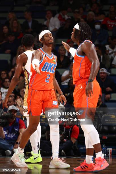 Shai Gilgeous-Alexander and Luguentz Dort of the Oklahoma City Thunder shake hands during the game against the New Orleans Pelicans on November 28,...