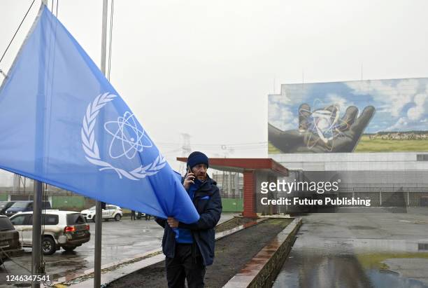 The flag with the symbols of the International Atomic Energy Agency is seen on the territory of the Chornobyl Nuclear Power Plant visited by the head...