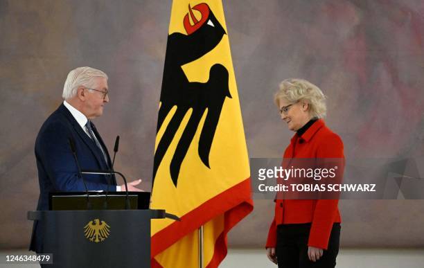 Germany's former Defence Minister Christine Lambrecht is handed over her dismissal order by German President Frank-Walter Steinmeier at the...