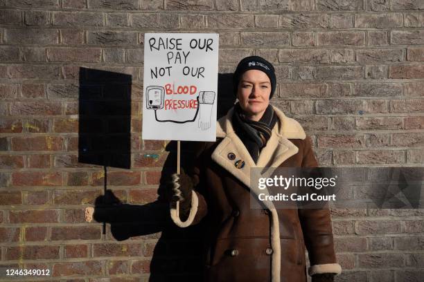 Nurse poses for a photograph with her placard during a strike by members of the Royal College of Nursing Union outside the Tavistock and Portman NHS...