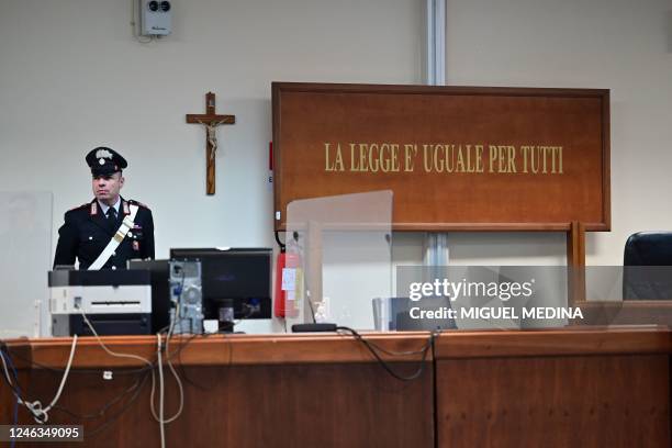 Police officer stands by the magistrates' desk in a special bunker court in Caltanissetta, Sicily, on January 19 where mafia boss Matteo Messina...