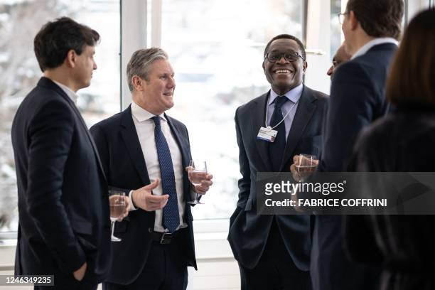 Britain's opposition Labour party leader Keir Starmer speaks with president of International for Bank of America Bernard Mensah and other members of...