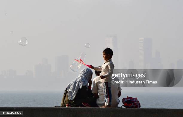 City skyline enveloped in dense smog, at Marine Drive on January 17, 2023 in Mumbai, India.