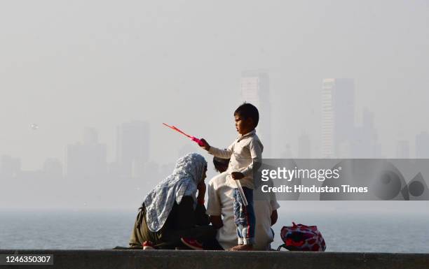 City skyline enveloped in dense smog, at Marine Drive on January 17, 2023 in Mumbai, India.