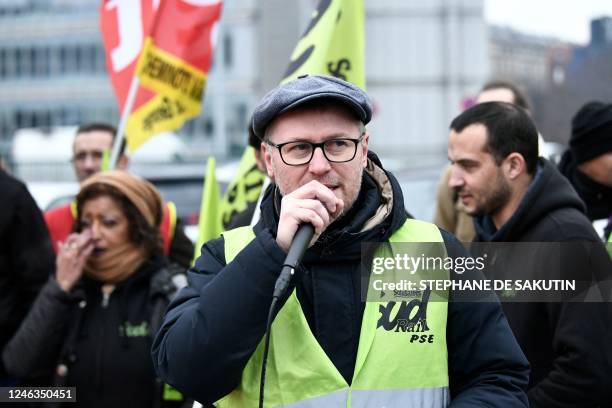 Fabien Villedieu, Sud-rail union delegate, addresses strikers during a rally called by French trade unions at the Gare de Lyon, in Paris on January...