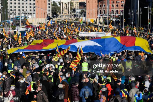 Protestors wave Catalan pro-independence "Estelada" flags during a demonstration on the sidelines of a Spanish-French summit in Barcelona on January...
