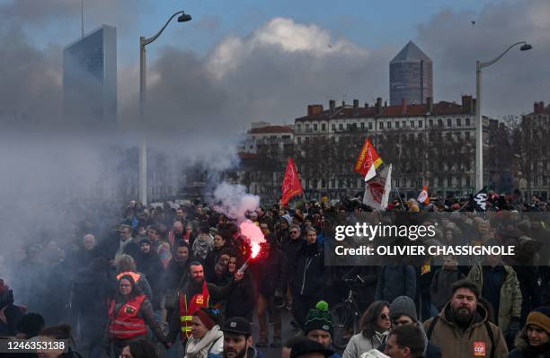 Demonstrators march during a rally in Lyon, south-eastern France on January 19 as workers go on strike over the French President's plan to raise the...