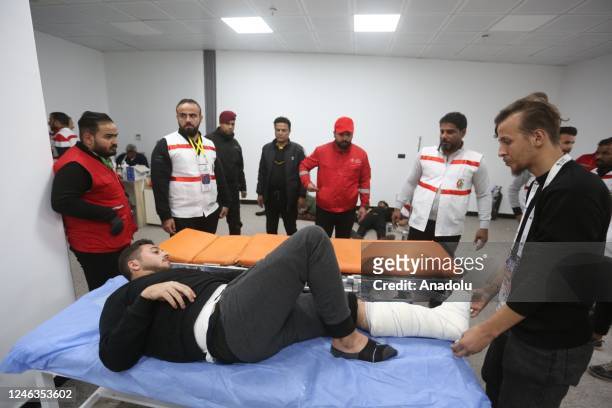 Injured people receive medical treatment at a hospital after crush took place outside stadium ahead of Arabian Gulf Cup final match between Iraq and...