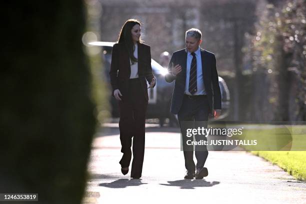 Britain's Catherine, Princess of Wales, is greeted by Simon Johnson , chair of the Rugby Football League, upon her arrival at Hampton Court Palace in...