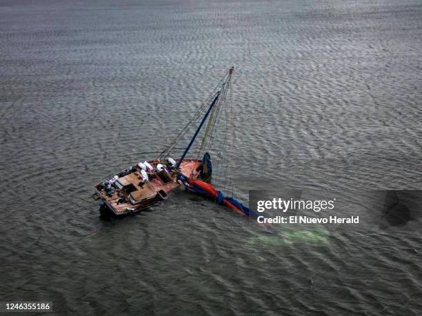 Haitian freighter used by Haitian migrants to travel to the United States sits in a sandbar off Key Largo in the Florida Keys on Jan. 14, 2023.