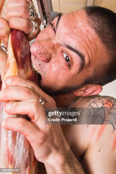 biting raw meat - gigot stock pictures, royalty-free photos & images