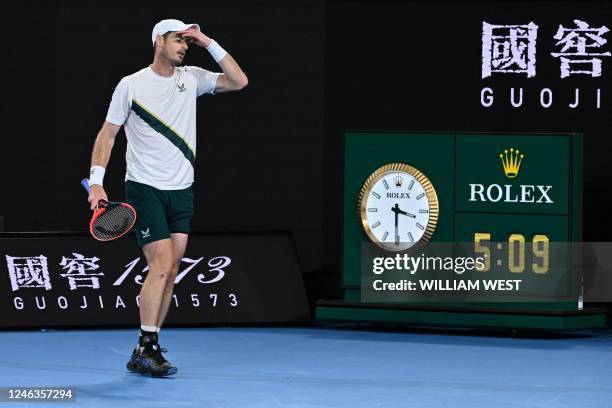 Britain's Andy Murray walks past the clock during his men's singles match against Australia's Thanasi Kokkinakis on day four of the Australian Open...