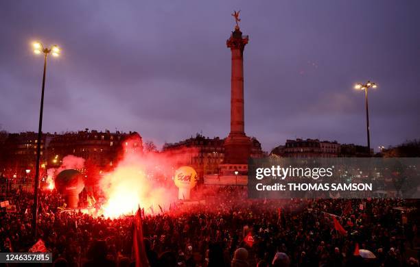 Demonstrators gahter in Place de la Bastille during a rally called by French trade unions in Paris on January 19, 2023. - A day of strikes and...