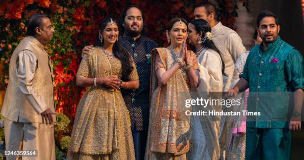 Mukesh Ambani, Radhika Merchant, Anant Ambani, Neeta Ambani, Isha Ambani Piramal, Anand Piramal, Shloka Mehta Ambani and Akash Ambani, pose for the...