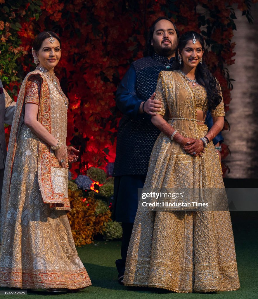 Anant Rbp's Neeta Ambani, Radhika Merchant and Anant Ambani, pose for the media ...