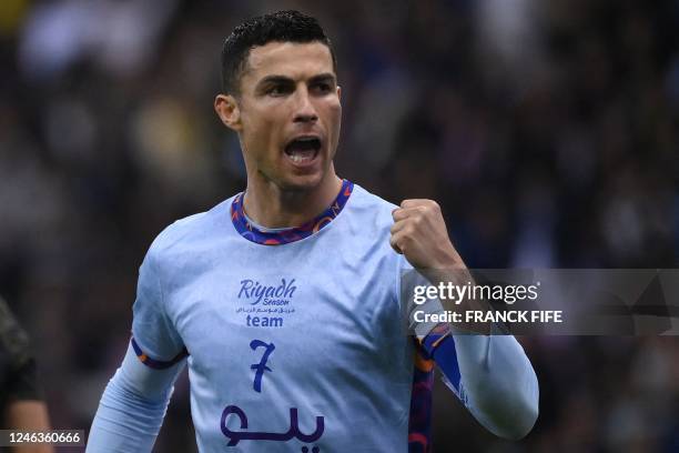 Riyadh All-Star's Portuguese forward Cristiano Ronaldo celebrates his team's third goal during the Riyadh Season Cup football match between the...