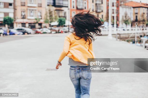 rear view female woman in casual clother running on the street - youth culture speed stock pictures, royalty-free photos & images