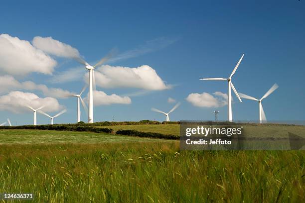 group of wind turbines generating power in cornwall, england - wind power uk stock pictures, royalty-free photos & images