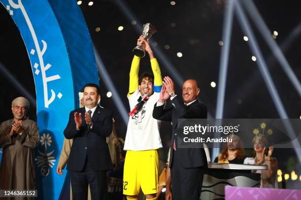 Goalkeeper Celal Hasan of Iraq lifts the trophy after the Arabian Gulf Cup final match between Iraq and Oman at Basra Stadium in Basra, Iraq on...