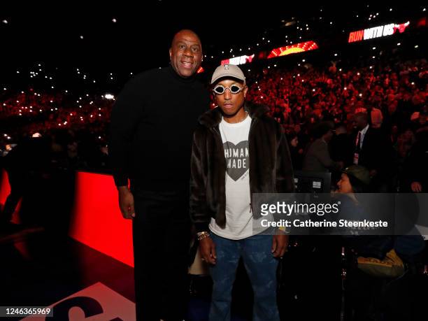 Magic Johnson and Pharrell Williams pose for a photo during the game between the Chicago Bulls and Detroit Pistons as part of NBA Paris Games 2023 on...