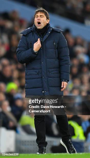 Tottenham Hotspur manager Antonio Conte shouts instructions to his team from the technical area during the Premier League match between Manchester...
