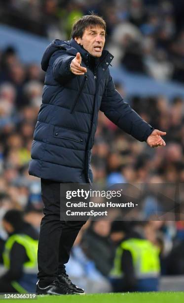 Tottenham Hotspur manager Antonio Conte shouts instructions to his team from the technical area during the Premier League match between Manchester...