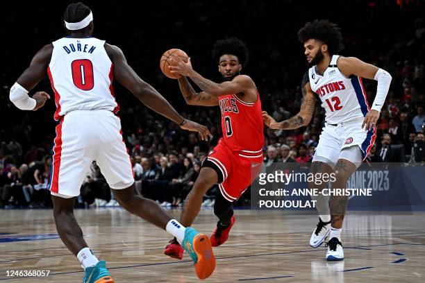 Chicago Bulls' US point guard Coby White fights for the ball with Detroit Pistons' US' small forward Isaiah Livers during the 2023 NBA Paris Games...