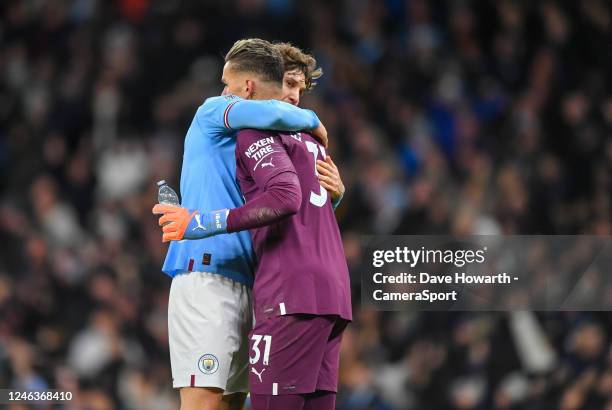 Manchester City's John Stones hugs Ederson after their side went 4-2 up during the Premier League match between Manchester City and Tottenham Hotspur...