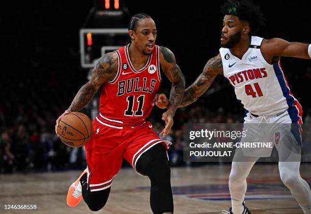 Chicago Bulls' US power forward DeMar Derozan fights for the ball with Detroit Pistons' US forward Saddiq Bey during the 2023 NBA Paris Games...